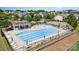 Community pool with fountain, lounge chairs, tables and umbrella seating surrounded by lush landscaping at 214 Blossom Ridge Dr, Mooresville, NC 28117