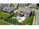 Aerial view of the house with an in-ground pool and manicured lawn at 220 Forsythia Ln, Tega Cay, SC 29708