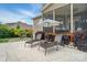 Inviting backyard patio with lounge chairs and an umbrella, perfect for relaxing outdoors at 220 Forsythia Ln, Tega Cay, SC 29708