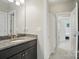 Bathroom vanity with granite countertop, undermount sink and open doorway with views of the bedroom at 220 Forsythia Ln, Tega Cay, SC 29708