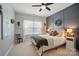 Cozy bedroom featuring a decorative wall, a ceiling fan and a well-lit window at 220 Forsythia Ln, Tega Cay, SC 29708