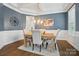 Sophisticated dining room featuring neutral walls, natural light, and a modern chandelier at 220 Forsythia Ln, Tega Cay, SC 29708