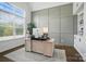 Bright home office with large window, custom wall paneling, and built-in bookshelves at 220 Forsythia Ln, Tega Cay, SC 29708