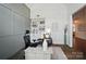 Spacious home office showcasing custom paneling, built-in bookshelves, and stylish decor at 220 Forsythia Ln, Tega Cay, SC 29708