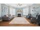 Cozy living room with fireplace, neutral paint, decor shelves, and a ceiling fan at 220 Forsythia Ln, Tega Cay, SC 29708