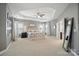 Expansive main bedroom with a tray ceiling, plush carpeting and filled with natural light at 220 Forsythia Ln, Tega Cay, SC 29708