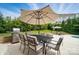 Outdoor patio area with dining table, grill, and ample seating for enjoying outdoor meals at 220 Forsythia Ln, Tega Cay, SC 29708