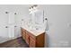 Bathroom features double sinks, wood cabinets and great lighting at 2306 Nettleton Ct, Matthews, NC 28105