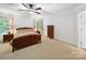 Comfortable bedroom with neutral carpet, ceiling fan, and natural light at 2306 Nettleton Ct, Matthews, NC 28105