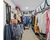 Walk-in closet features organized storage with clothing racks and shelving at 2306 Nettleton Ct, Matthews, NC 28105