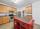 Well-lit kitchen with stainless steel appliances and a functional center island at 2306 Nettleton Ct, Matthews, NC 28105