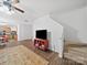 Bright and airy living room boasts stairs to upper level at 2306 Nettleton Ct, Matthews, NC 28105