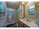 Bathroom features walk-in shower with glass doors and white sink with storage at 2310 Alexis Lucia Rd, Stanley, NC 28164