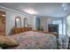 This bedroom offers generous space, carpeted floors, a dresser and an exterior door at 2310 Alexis Lucia Rd, Stanley, NC 28164