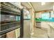Kitchen features stainless steel refrigerator and dishwasher and view into dining area at 2310 Alexis Lucia Rd, Stanley, NC 28164