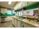 Spacious kitchen boasts laminate floors, breakfast bar, and stainless steel dishwasher and sink at 2310 Alexis Lucia Rd, Stanley, NC 28164
