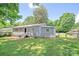 A single-story home with a fenced backyard and a small patio area at 2409 Thornton Rd, Charlotte, NC 28208