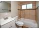 Full bathroom with tiled walls, updated fixtures, and a shower-tub combo at 2409 Thornton Rd, Charlotte, NC 28208
