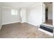 Bright bedroom has neutral walls, trim and wood grain flooring, with a window, door and exterior access at 2409 Thornton Rd, Charlotte, NC 28208