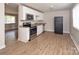 Well lit kitchen featuring granite counters and stainless steel appliances at 2409 Thornton Rd, Charlotte, NC 28208