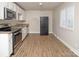 Open kitchen with stainless steel appliances, and granite countertops at 2409 Thornton Rd, Charlotte, NC 28208