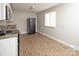 Bright kitchen features stainless steel appliances and white cabinets at 2409 Thornton Rd, Charlotte, NC 28208