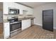 Charming kitchen with stainless steel appliances, granite countertops, and ample cabinet space at 2409 Thornton Rd, Charlotte, NC 28208