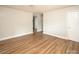 Cozy living room with wood flooring and neutral paint throughout at 2409 Thornton Rd, Charlotte, NC 28208