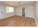 Inviting living room with wood floors and plenty of natural light at 2409 Thornton Rd, Charlotte, NC 28208