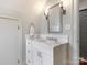 Updated bathroom featuring a vanity with marble countertop and modern fixtures at 2410 Vernon Dr, Charlotte, NC 28211