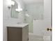 Bathroom featuring a glass enclosed shower and a sink with marble countertop at 2410 Vernon Dr, Charlotte, NC 28211