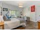 Bedroom with a cozy sitting area by a sun-drenched window, and hardwood floors at 2410 Vernon Dr, Charlotte, NC 28211