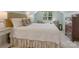 Bedroom with a plush bed, patterned chairs, and bright window creating a cozy and inviting retreat at 2410 Vernon Dr, Charlotte, NC 28211