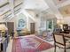 Spacious bonus room with sloped ceilings, skylights, and a large rug offers flexible living space at 2410 Vernon Dr, Charlotte, NC 28211
