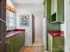 Cozy kitchen features wooden cabinets, a stainless steel sink, and a window bringing in natural light at 2410 Vernon Dr, Charlotte, NC 28211