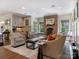 Comfortable living room features brick fireplace, and natural light at 2410 Vernon Dr, Charlotte, NC 28211
