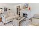 Comfortable living room with a fireplace, decorative art, and a large sofa creating an inviting atmosphere at 2410 Vernon Dr, Charlotte, NC 28211