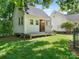 An outbuilding stands on a lush lawn, offering versatile space for hobbies or storage at 2410 Vernon Dr, Charlotte, NC 28211