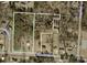 Aerial view of property, showing lot boundaries, surrounding wooded area, and nearby roads at 2645 Kool Park Ne Rd, Hickory, NC 28601