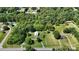Aerial view of the neighborhood with lush trees and the home at the center of the wooded lot at 2645 Kool Park Ne Rd, Hickory, NC 28601