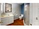 This bathroom features a single sink vanity, toilet, and shower with glass doors at 2645 Kool Park Ne Rd, Hickory, NC 28601