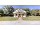 Front exterior of the two-story home with a welcoming front porch, columns, and brick foundation at 2645 Kool Park Ne Rd, Hickory, NC 28601