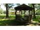 Rustic gazebo with seating, surrounded by trees offering a peaceful retreat on the property at 2645 Kool Park Ne Rd, Hickory, NC 28601