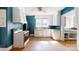 Charming kitchen with a vintage stove, wood floors, and natural light streaming through the window at 2645 Kool Park Ne Rd, Hickory, NC 28601
