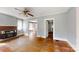 Inviting living room with a vintage brick fireplace and wood floors at 2645 Kool Park Ne Rd, Hickory, NC 28601