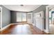 A classic living room boasting wood floors, large windows, and built-in shelving at 2645 Kool Park Ne Rd, Hickory, NC 28601