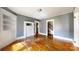 A charming living room featuring wood floors, built-in shelving, and a decorative fireplace at 2645 Kool Park Ne Rd, Hickory, NC 28601