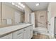 Bathroom featuring a spacious vanity with double sinks and a tub with tiled shower at 2750 Victory Ct, Fort Mill, SC 29715
