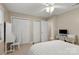 Bedroom featuring a writing desk, closet, neutral colors, and a ceiling fan at 2750 Victory Ct, Fort Mill, SC 29715