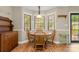 Cozy breakfast nook featuring a round wood table and bright natural light from the bay window at 2750 Victory Ct, Fort Mill, SC 29715